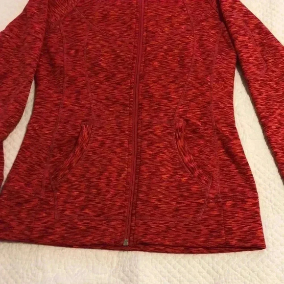 Athleta hoodie with two open pockets on front and zippered pocket on sleeve. - Picture 2 of 13